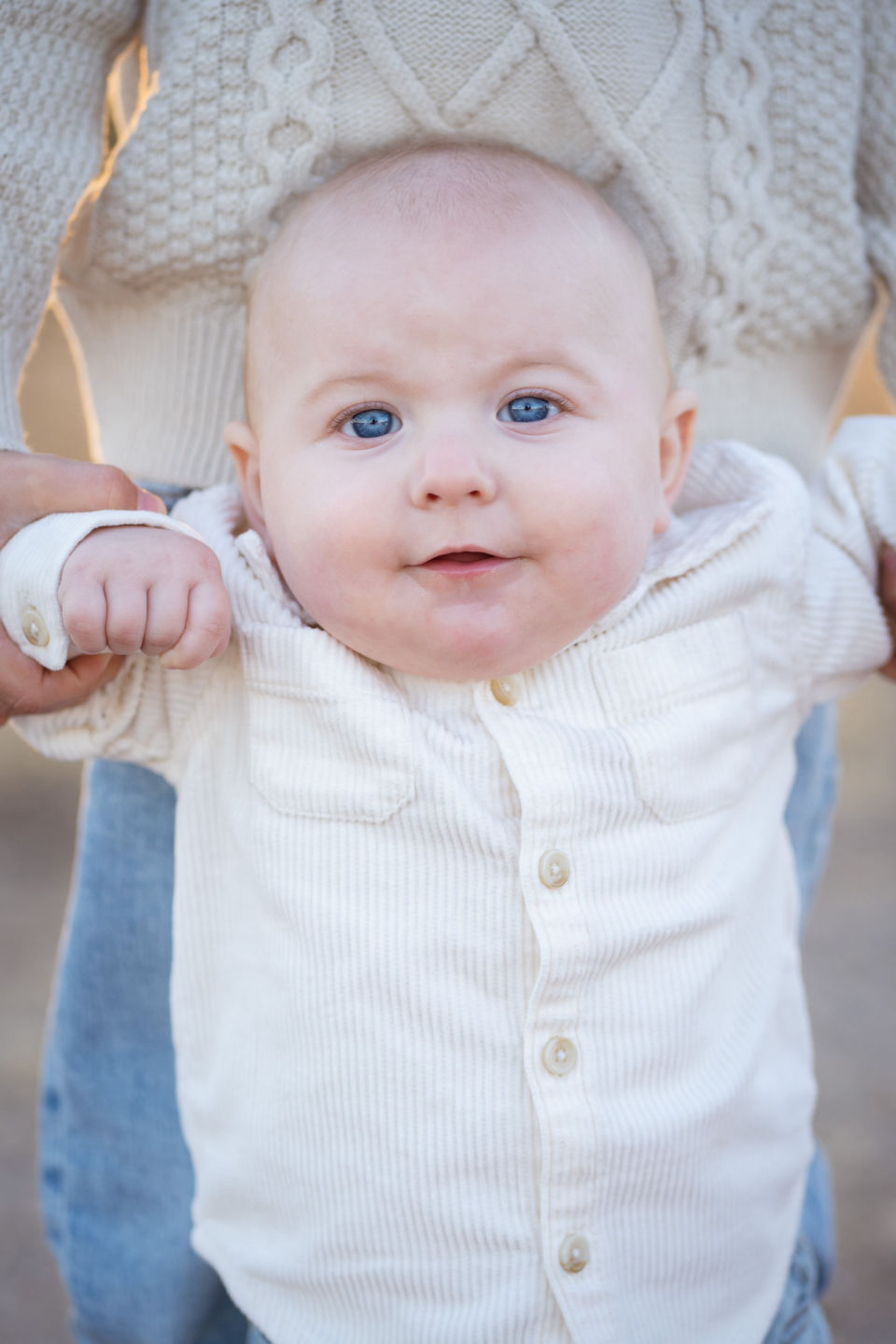 Close portrait of a baby in soft evening light.